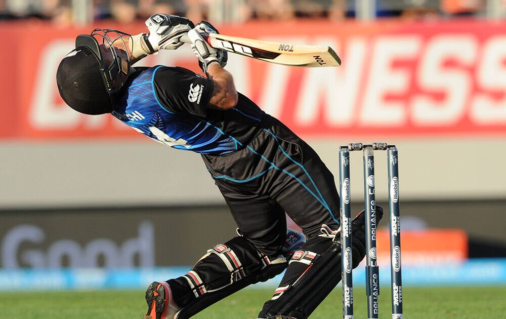 New Zealand's Luke Ronchi avoids a ball from Australian bowler Mitchell Starc during their Cricket World Cup match in Auckland