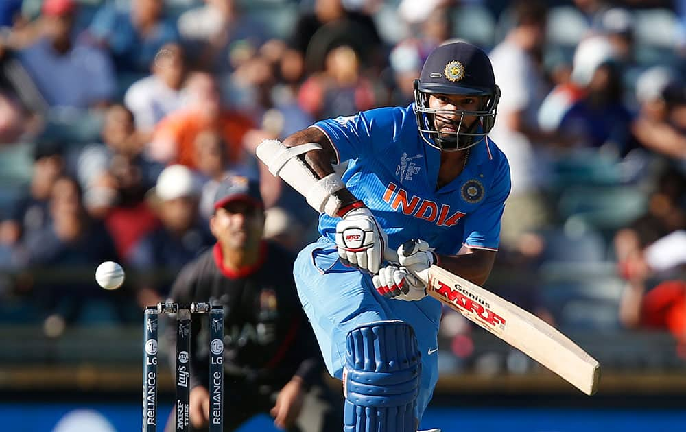 India's Shikhar Dhawan plays a shot during their Cricket World Cup Pool B match against the United Arab Emirates in Perth, Australia.