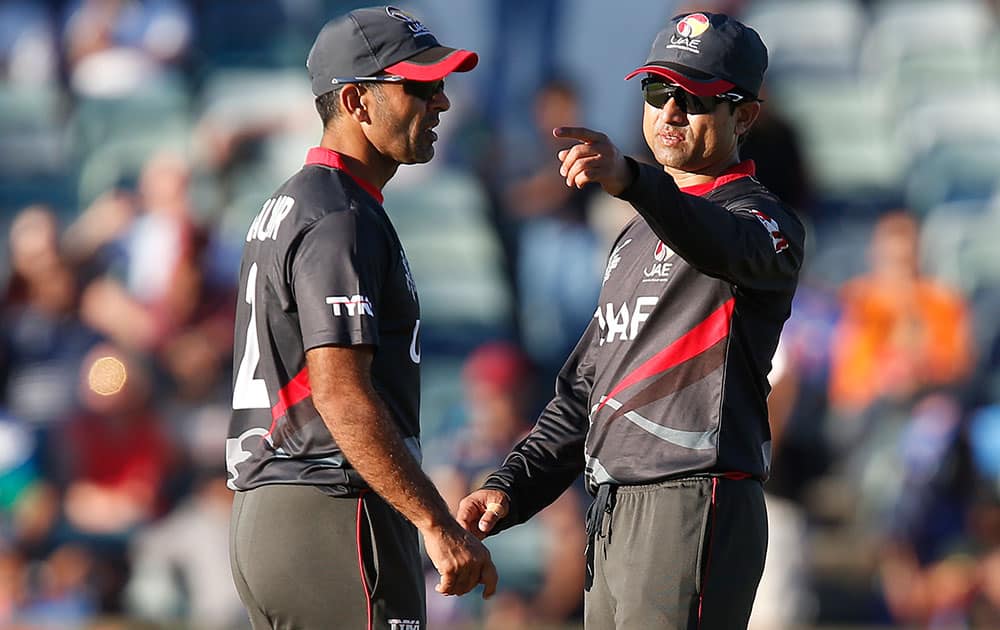 United Arab Emirates Shaiman Anwar right, points while he speaks to Mohamed Tauqir during their Cricket World Cup Pool B match against India in Perth, Australia.