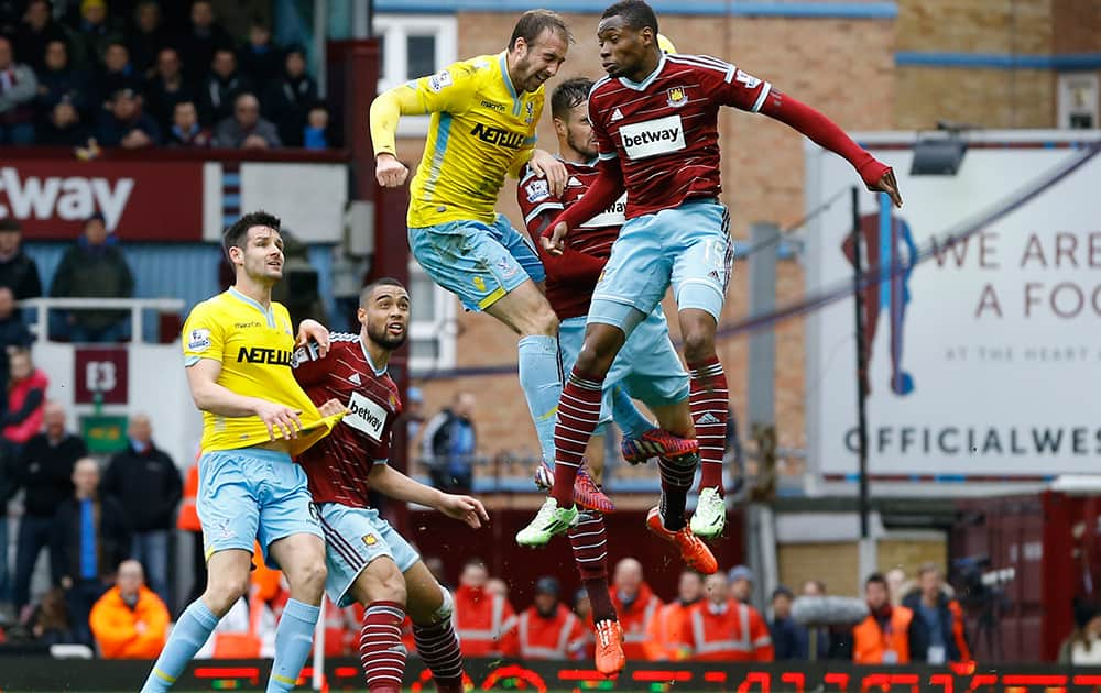 Crystal Palace's Glenn Murray heads in a goal during the English Premier League soccer match between West Ham United and Crystal Palace at the Boleyn Ground in London.