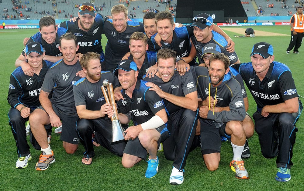 The New Zealand team pose with the Chappell Hadlee after defeating Australia in their Cricket World Cup match in Auckland, New Zealand.