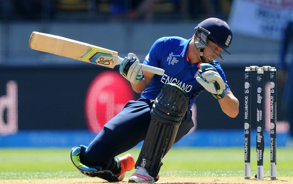 England's Jos Buttler falls as he avoid s a ball during their Cricket World Cup match against Sri Lanka in Wellington, New Zealand.