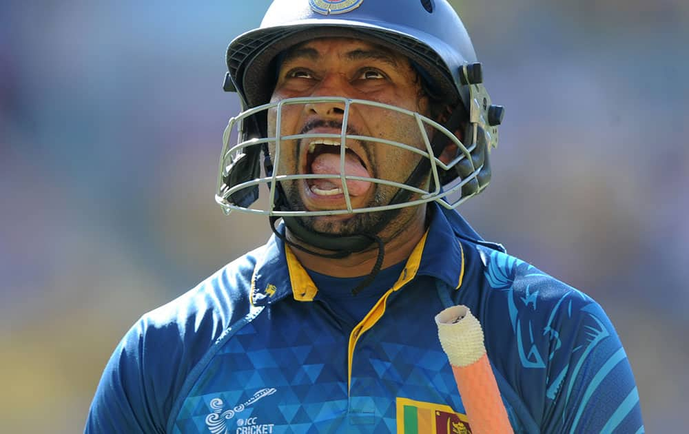 Sri Lanka's Tillakaratne Dilshan reacts as he leaves the field after he was dismissed for 44 runs during their Cricket World Cup match against England in Wellington, New Zealand.