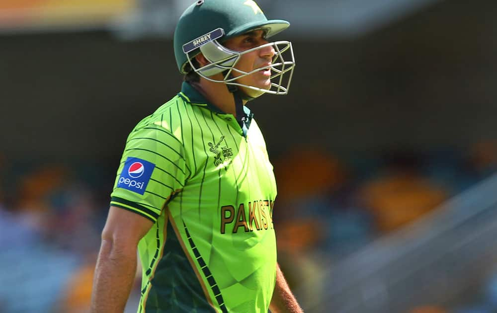 Pakistan's Nasir Jamshed walks after his dismissal during the Pool B Cricket World Cup match between Pakistan and Zimbabwe in Brisbane, Australia.