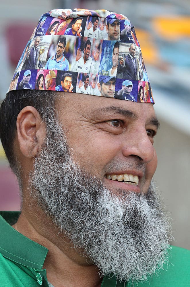 A Pakistani fan sports a cap with pictures of Indian captain M.S.Dhoni during the Pool B Cricket World Cup match between Pakistan and Zimbabwe in Brisbane, Australia.