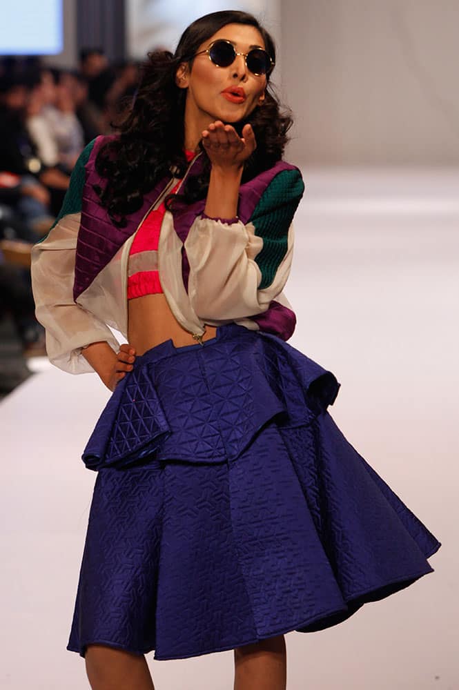 A model presents creations by Pakistan Institute of Fashion and Design at Expo Pakistan Fashion Show.