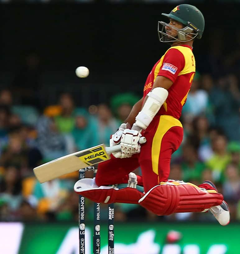 Zimbabwe's Sikandar Raza avoids a bouncer as he bats during the Pool B Cricket World Cup match against Pakistan in Brisbane, Australia.