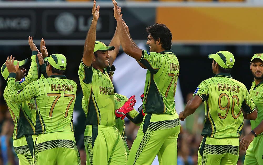 Pakistan players celebrate with wicket of Zimbabwe's Chamunorwa Chibhabha during the Pool B Cricket World Cup match in Brisbane, Australia.