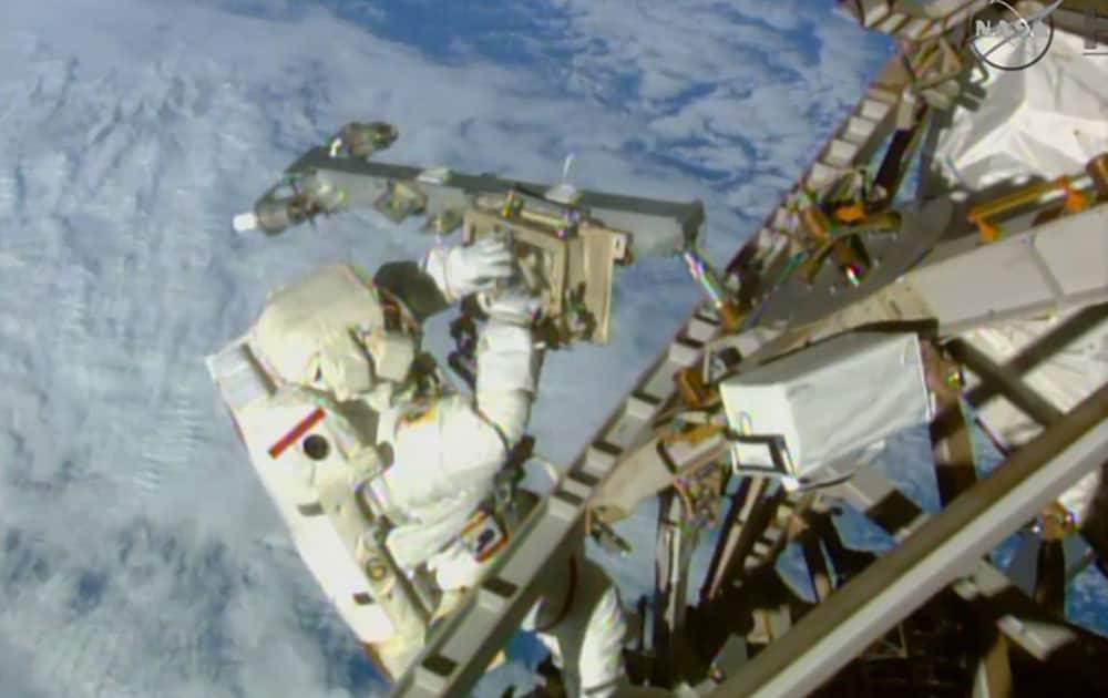 In this image from NASA television astronaut Terry Virts installs an antenna and boom during the third spacewalk outside the International Space Station.