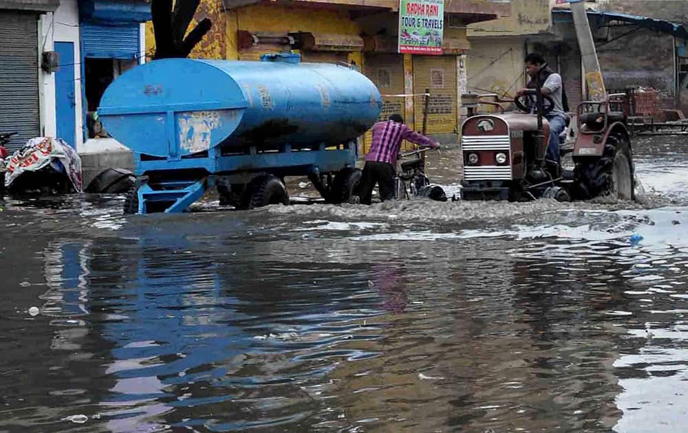 A waterlogged street after the early morning showers in the national capital and surrounded regions, in Faridabad.