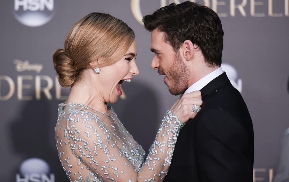 Lily James, left, and Richard Madden arrive at the Premiere Of 