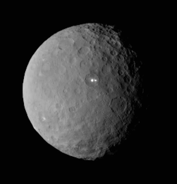 This image shows the swarf planet Ceres provided by NASA, taken by the agency's Dawn spacecraft from a distance of nearly 29,000 miles (46,000 kilometers). It shows that the brightest spot on Ceres has a dimmer companion, which apparently lies in the same basin, seen at center of the image.