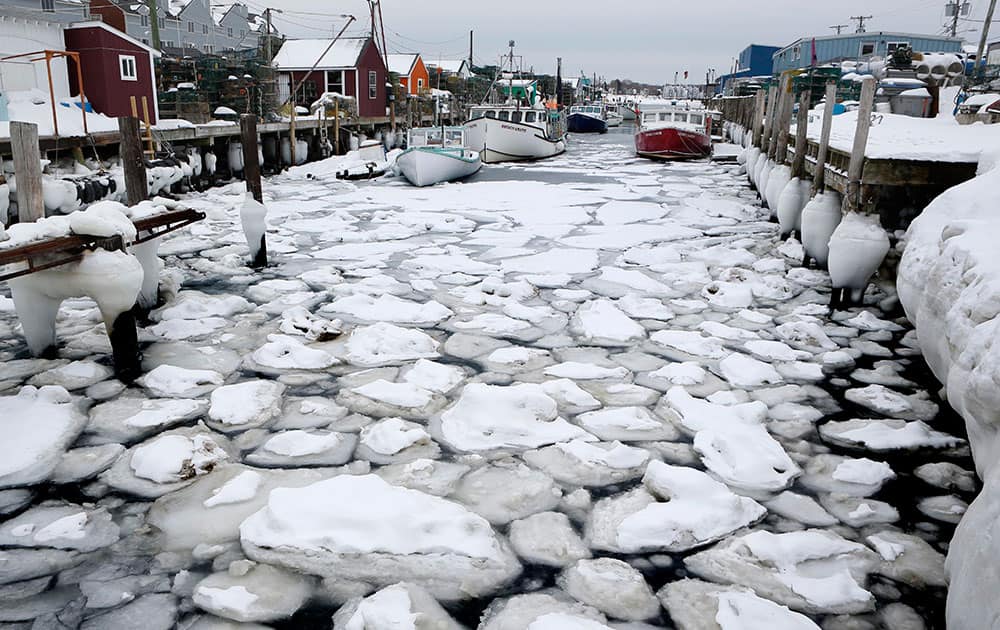 ice clogs the water between wharves in Portland, Maine. Portland Harbor is encountering more ice than it has in years thanks to the coldest February on record. Several lobster boats were locked in the ice, unable to move, and ice breakers are needed to keep commerce flowing. 