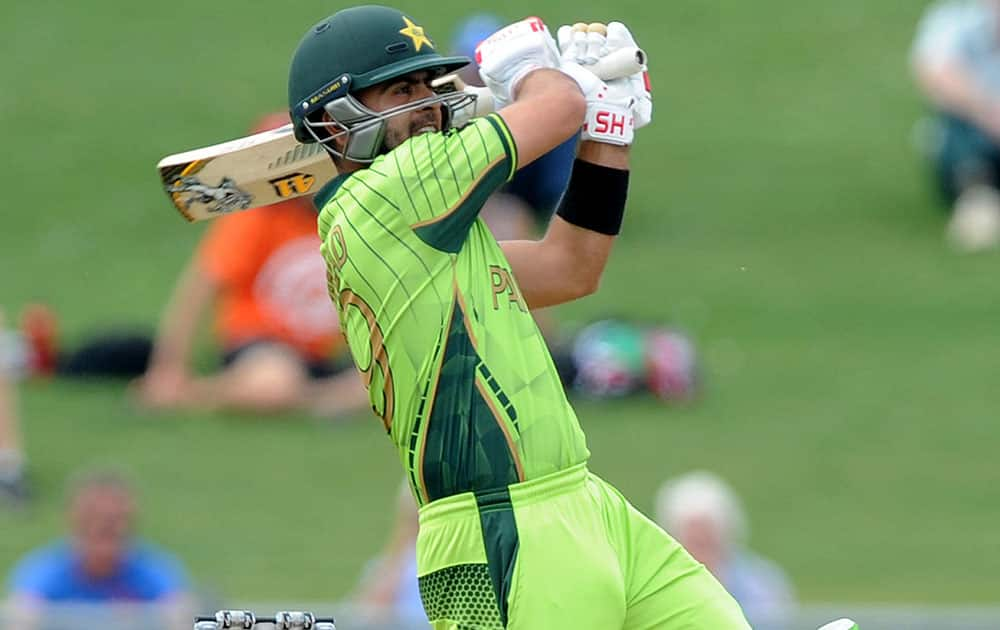 Pakistan's Ahmad Shahzad plays a pull shot while batting against the United Arab Emirates during their Cricket World Cup Pool B match in Napier, New Zealand.