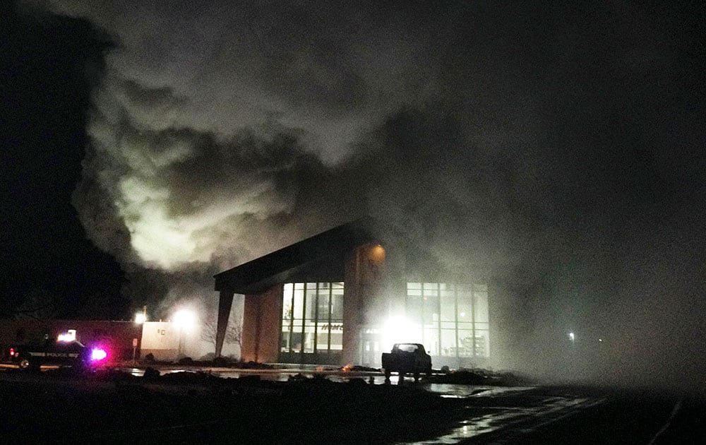 smoke rising from a fire at the Rite of Passage Silver State Academy near Yerington, Nev. Authorities are investigating a riot at a juvenile rehabilitation camp in northern Nevada where two buildings were set on fire, four staff members hurt and 10 youths briefly escaped before they were recaptured over the weekend.