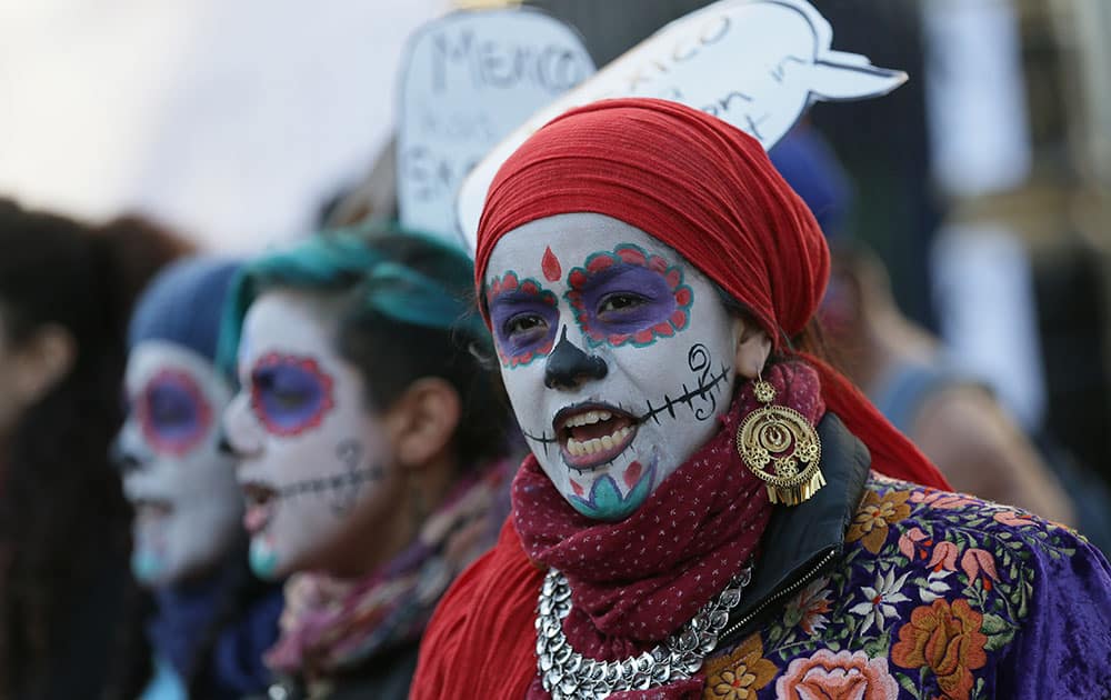 Protesters chant during a demonstration opposing the state visit to Britain of the President of Mexico, Enrique Pena Nieto, opposite Downing Street on Whitehall, in London.