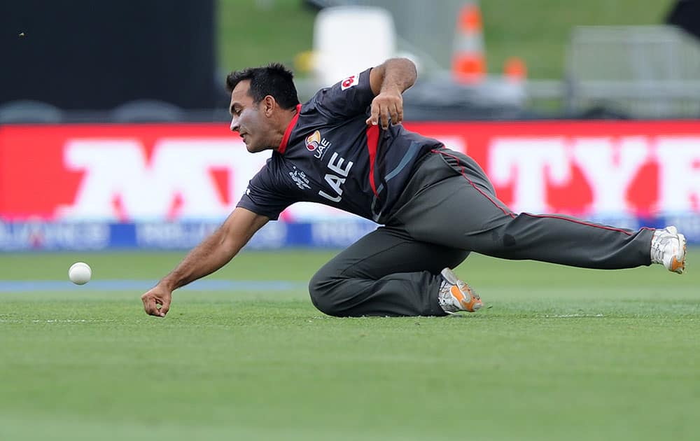 United Arab Emirates Mohamed Tauqir attempts to catch the ball while fielding during their Cricket World Cup Pool B match against Pakistan in Napier, New Zealand.