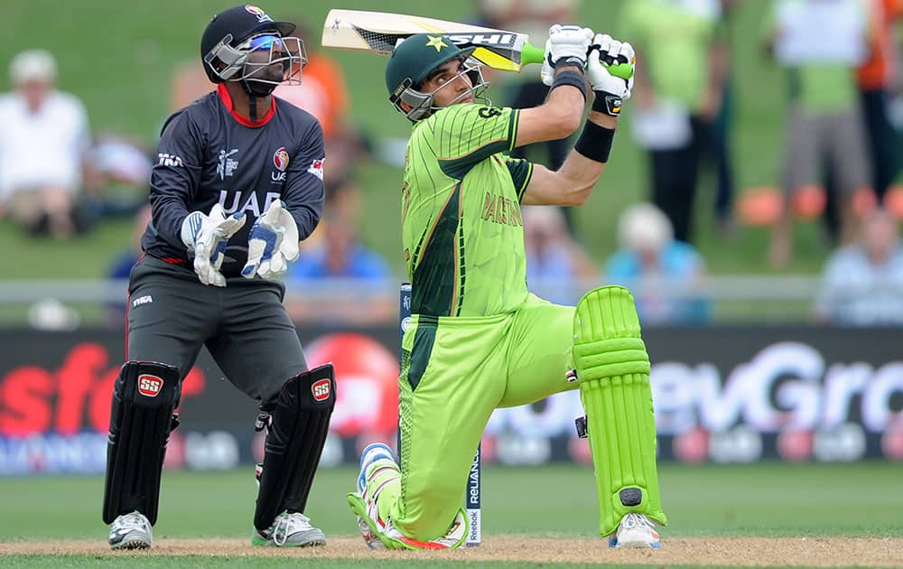 Pakistan's Misbah Ul Haq plays a shot as United Arab Emirates wicketkeeper Swapnil Patil watches during their Cricket World Cup Pool B match in Napier, New Zealand.