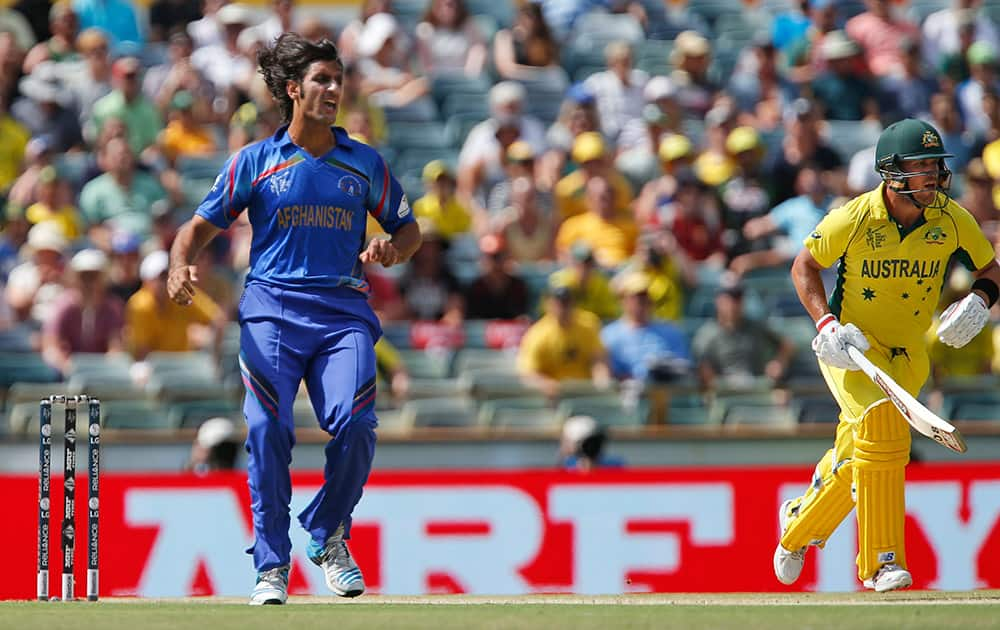 Australia's Aaron Finch looks to take a run after a ball by Afghanistan’s Shapoor Zadran during their Cricket World Cup Pool A match in Perth, Australia.