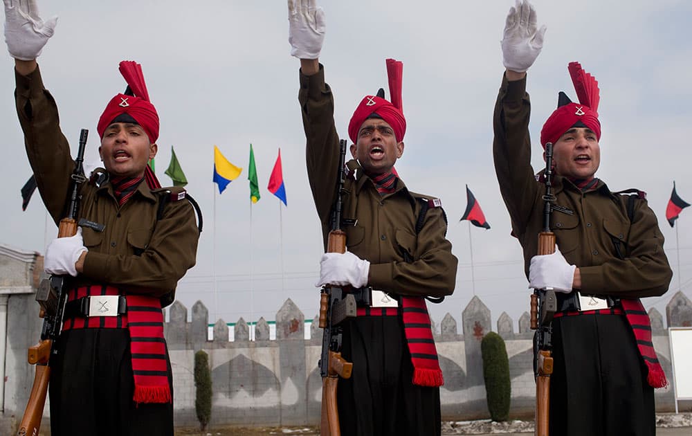 Newly graduated soldiers of the Jammu and Kashmir Light Infantry take oath during their commencement parade at a military base on the outskirts of Srinagar, India.