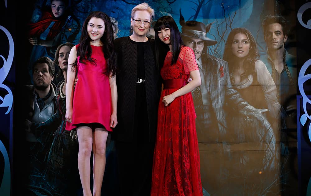 Actress Meryl Streep, Lilla Crawford and Japanese actress Sayaka Kanda pose for photographers during the Japan premiere of 'Into The Woods' in Tokyo.