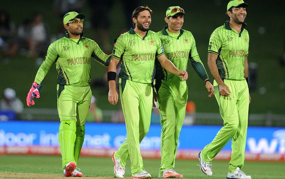 Pakistan players celebrate the dismissal of United Arab Emirates batsman Rohan Mustafa during their Cricket World Cup Pool B match in Napier, New Zealand.