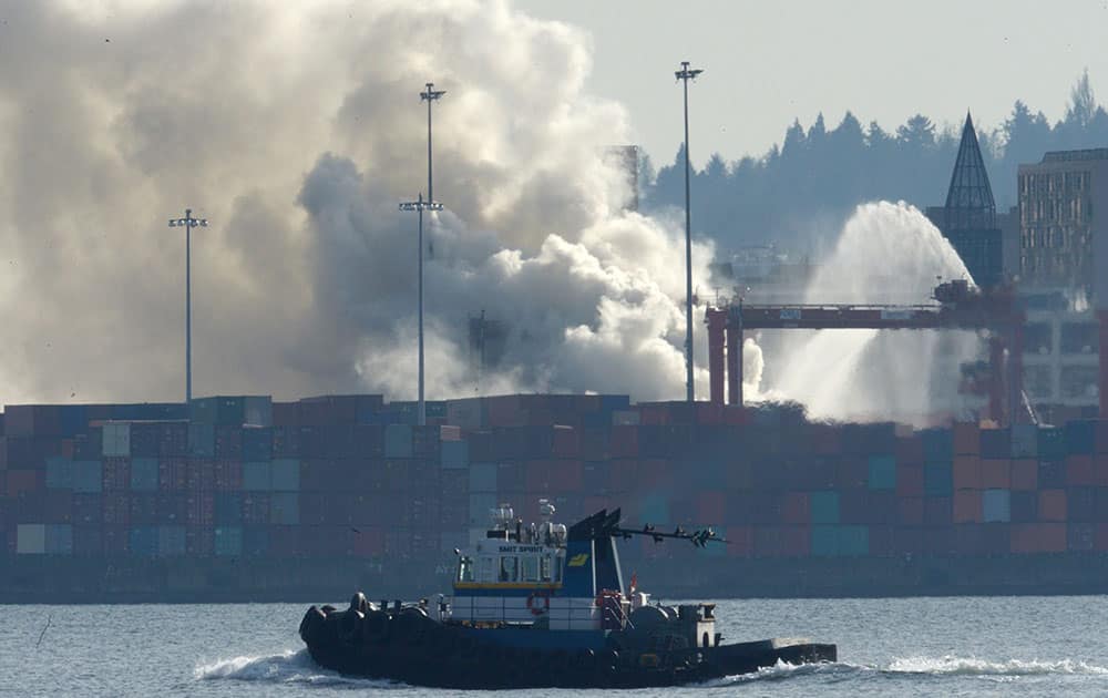 Smoke rises from a fire at the Port Metro Vancouver in Vancouver, British Columbia, Canada.