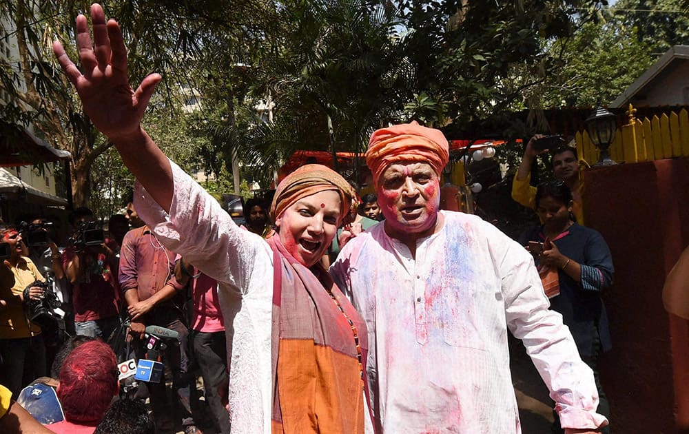 Actress Shabana Azmi and her husband lyricist Javed Akhtar celebrate Holi at their residence in Mumbai.