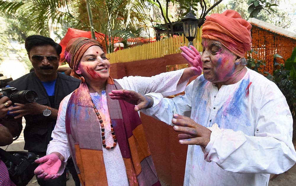 Actress Shabana Azmi and her husband lyricist Javed Akhtar celebrate Holi at their residence in Mumbai.