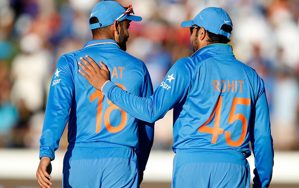 Rohit Sharma congratulates teammate Virat Kohli after his catch to dismiss West Indies batsman Jason Holder during their Cricket World Cup Pool B match in Perth, Australia.