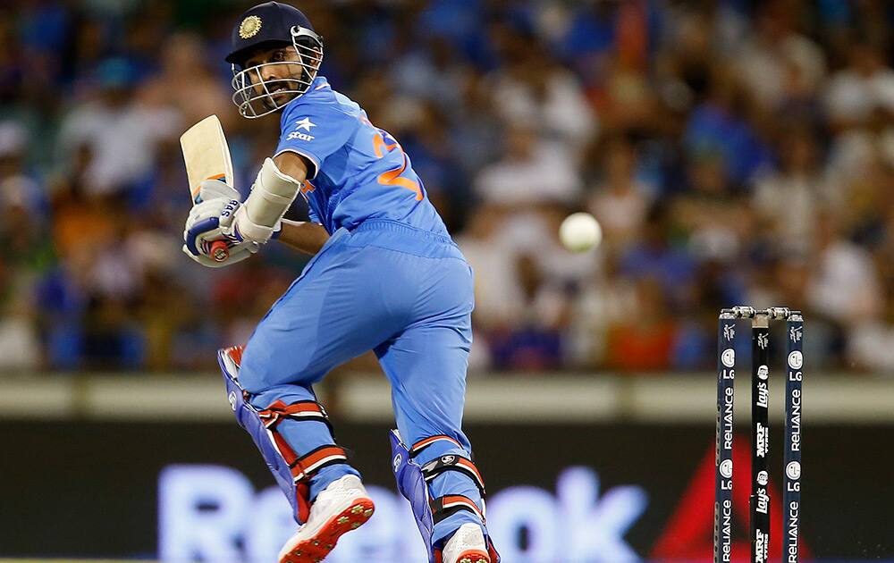 Ajinkya Rahane watches the ball while batting against the West Indies during their Cricket World Cup Pool B match in Perth, Australia.