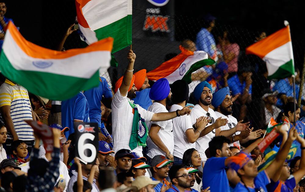 Indian fans cheer their team on during their Cricket World Cup Pool B match against the West Indies in Perth, Australia.