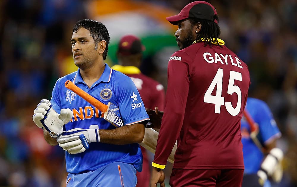 M S Dhoni is congratulated by West Indies Chris Gayle after there four wicket win in their Cricket World Cup Pool B match in Perth, Australia.