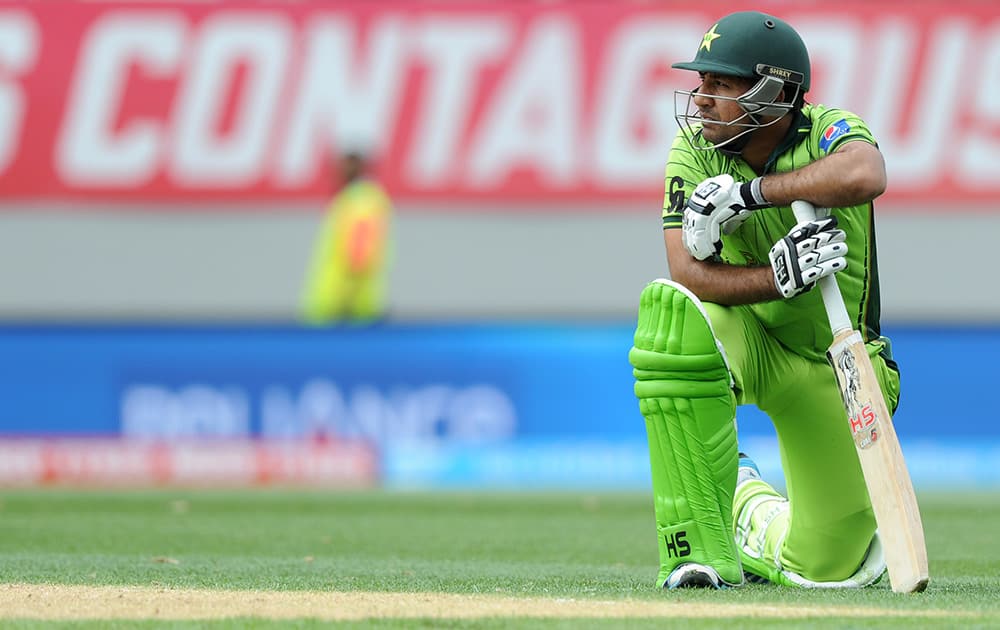 Pakistan's Sarfraz Ahmed rests on his bat after he was run out for 49 runs during their Cricket World Cup Pool B match against South Africa in Auckland, New Zealand.