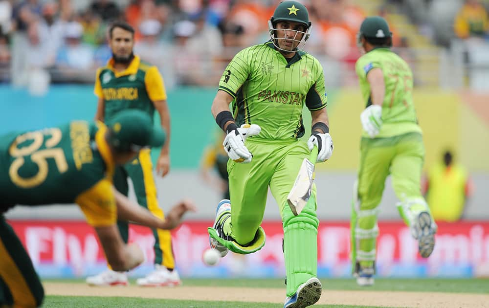 Pakistan's Younus Khan runs down the wicket as South Africa's Morne Morkel throws the ball at the stumps during their Cricket World Cup Pool B match in Auckland, New Zealand.