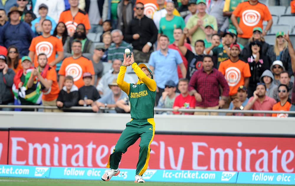 South Africa's J.P. Duminy takes a catch to dismiss Pakistan batsman Shahid Afridi for 22 runs during their Cricket World Cup Pool B match in Auckland, New Zealand.