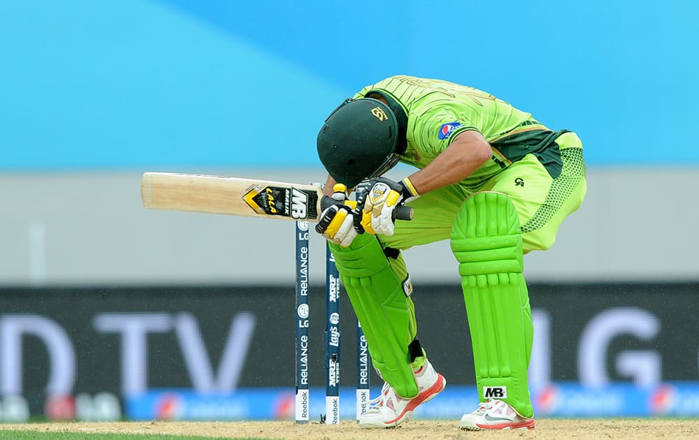 Pakistan's Shahid Afridi ducks under a bouncer while batting against South Africa during their Cricket World Cup Pool B match in Auckland, New Zealand.