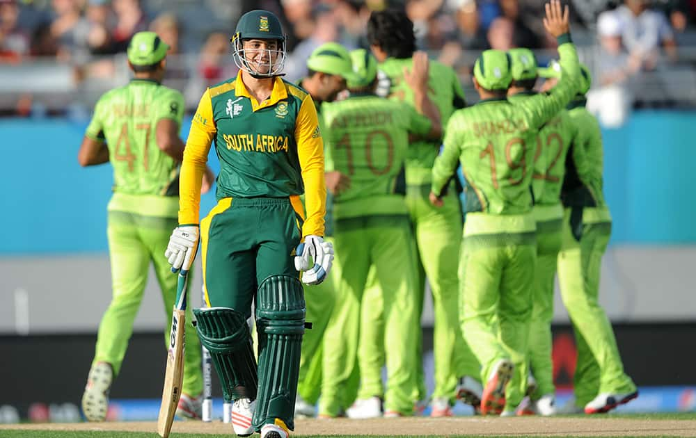 South African batsman Quinton De Kock walks from the field after he was dismissed for no score during their Cricket World Cup Pool B match in Auckland, New Zealand.