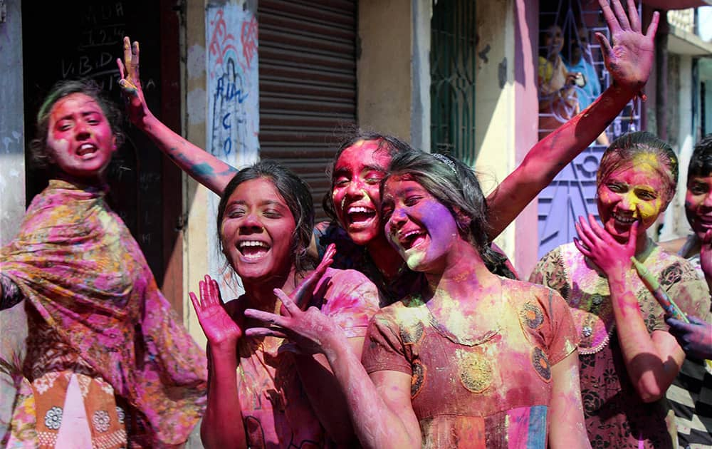  Young girls enjoy during the Holi festival at Malda in West Bengal.