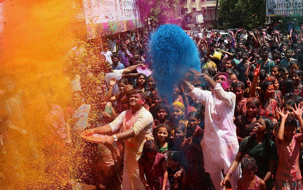 People celebrate Holi in Thane near Mumbai.