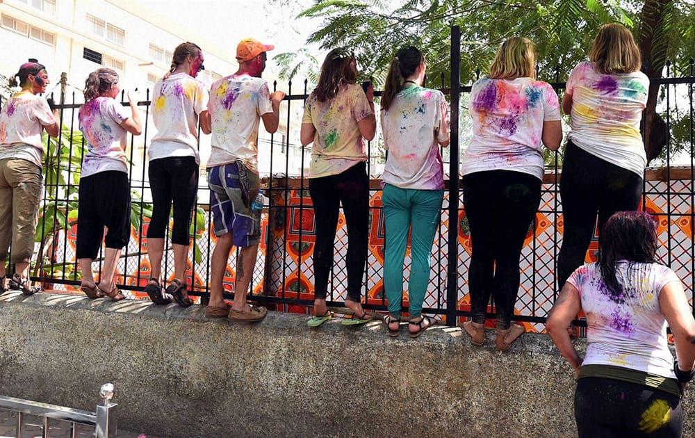 Foreigners celebrate Holi festival in Mumbai.