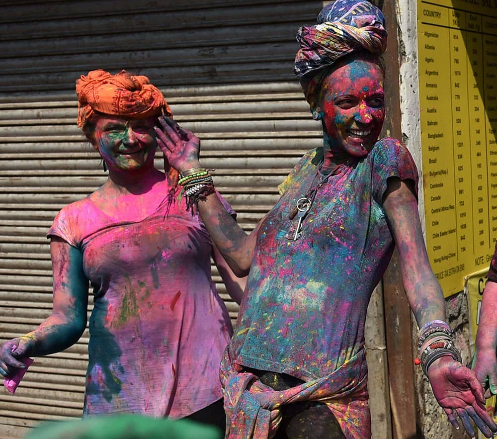 Foreigners celebrate “Holi ‘ in New Delhi.