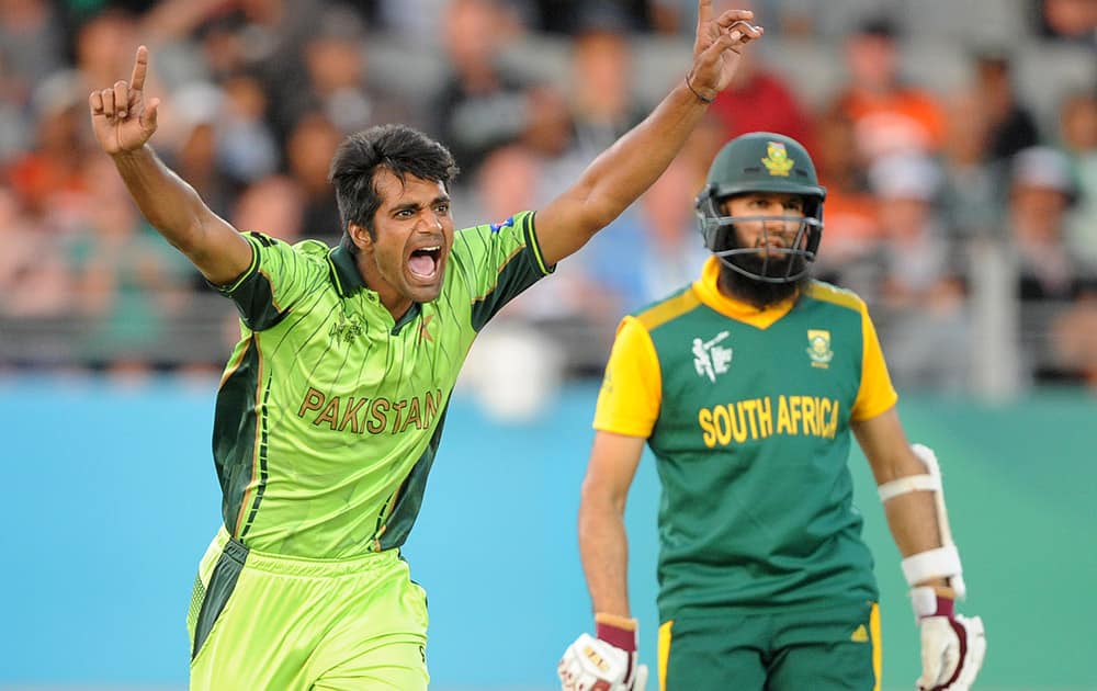 Pakistan's Rahat Ali celebrates after taking the wicket of South Africa's Francois Du Plessis as Hashim Amla watches during their Cricket World Cup Pool B match in Auckland, New Zealand.