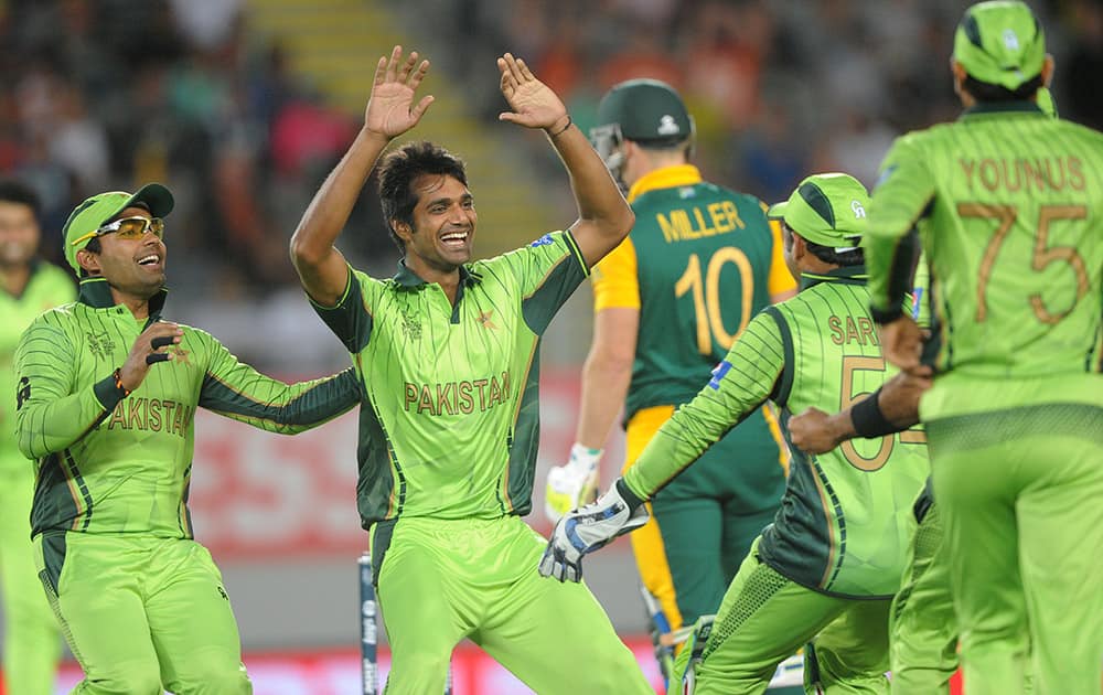 Pakistan bowler Rahat Ali celebrates with his teammates after dismissing South African batsman David Miller during their Cricket World Cup Pool B match in Auckland, New Zealand.