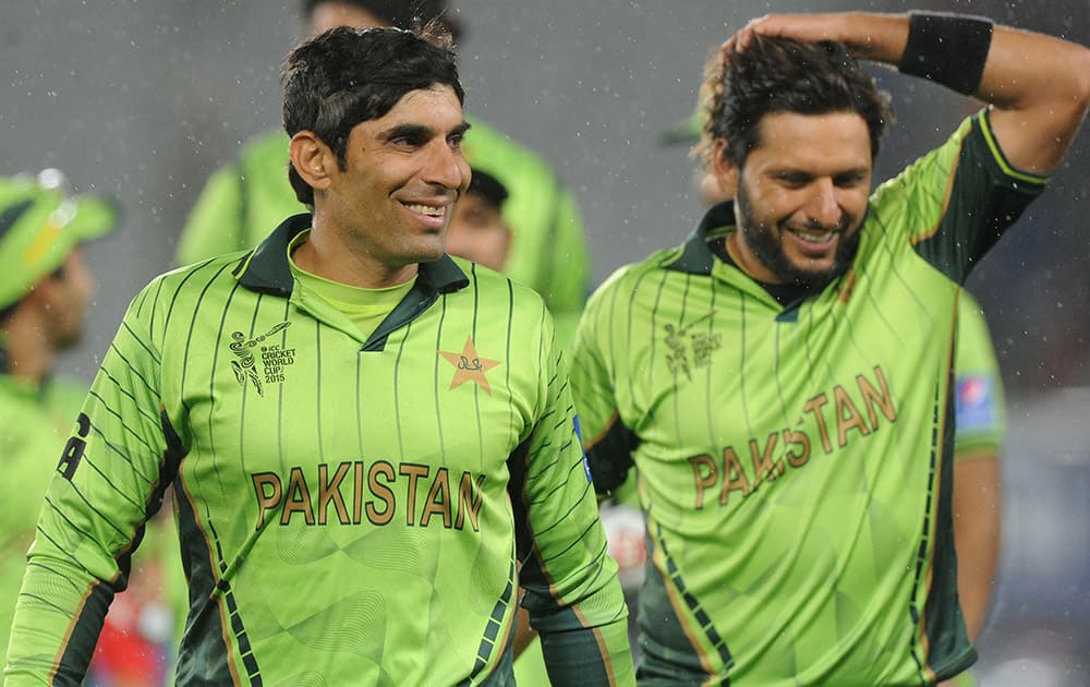 Pakistan's captain Misbah Ul Haq and teammate Shahid Afridi smile as they leave the field after their 29 run win over South Africa in their Cricket World Cup Pool B match in Auckland, New Zealand.