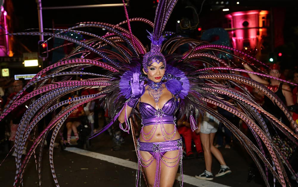 A participant of the 37th annual Sydney Gay and Lesbian Mardi Gras Parade performs through Sydney.