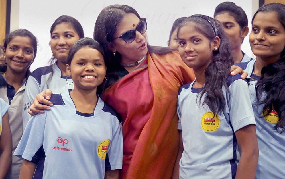 Bollywood actress and social activist Shabana Azmi with underprivileged girls at an International Womens Day event in Mumbai.