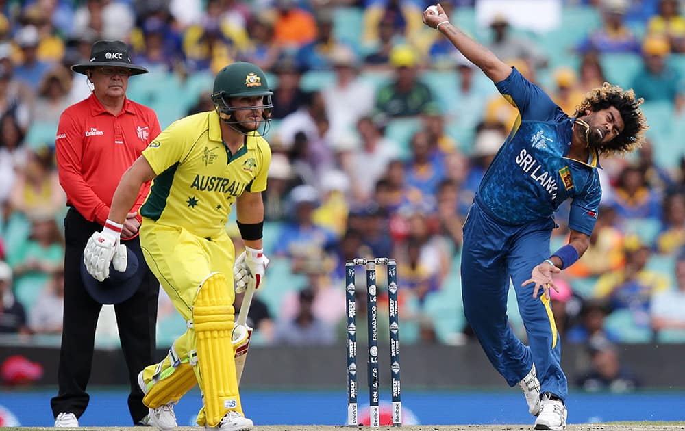 Sri Lanka's Lasith Malinga bowls as Australian batsman Aaron Finch watches during their Cricket World Cup Pool A match in Sydney, Australia.