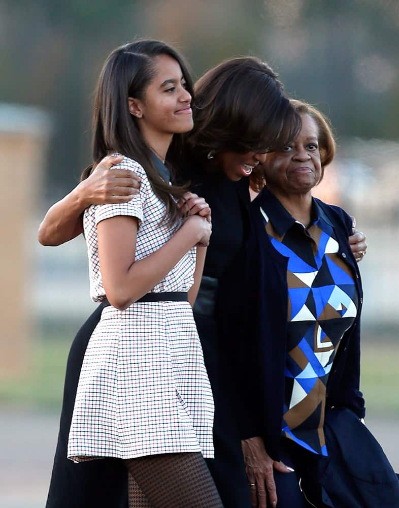 Malia Obama, first lady Michelle Obama, and Marian Robinson walk towards Air Force One after President Barack Obama spoke at the 50th anniversary commemoration of 