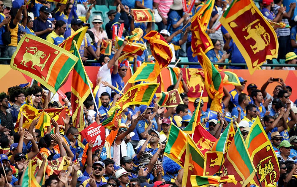 Sri Lankan fans cheer on their team during their Cricket World Cup Pool A match against Australia in Sydney, Australia.